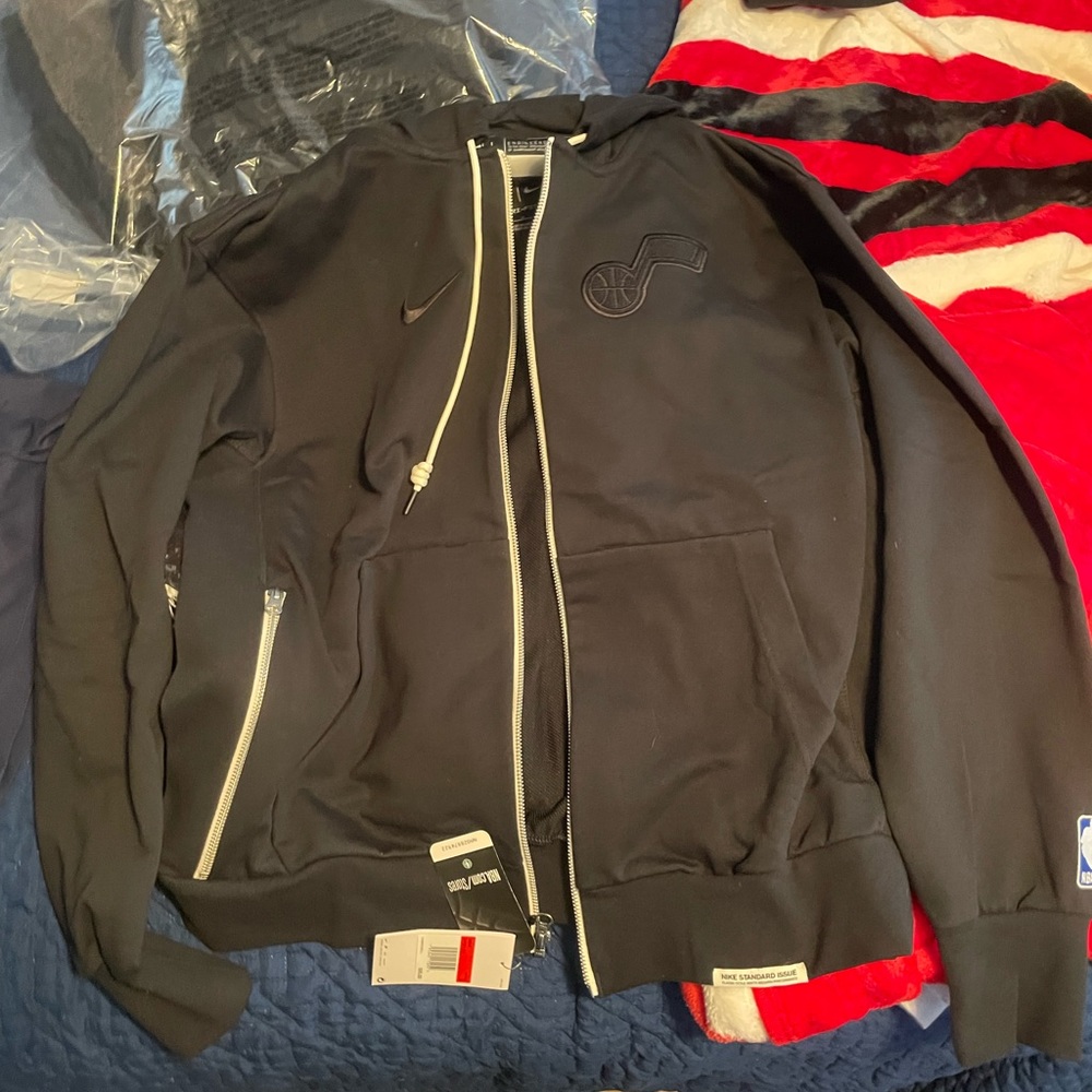Brand new Utah Jazz zip up sweatshirt size large. Color black with white.